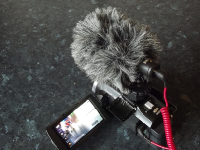 Sony FDR-PJ620 with ROde VideoMicro mounted.